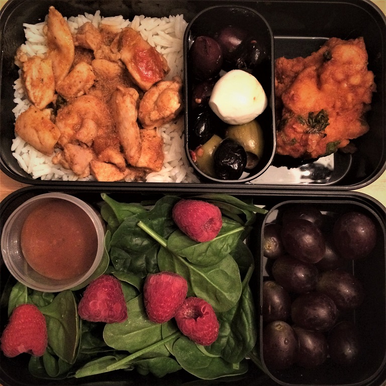 CW from top left: curry chicken with rice, olive bar stuff, takeout lasuni gobi, grapes, spinach and raspberry salad.